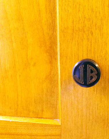 JB initials on locker knob